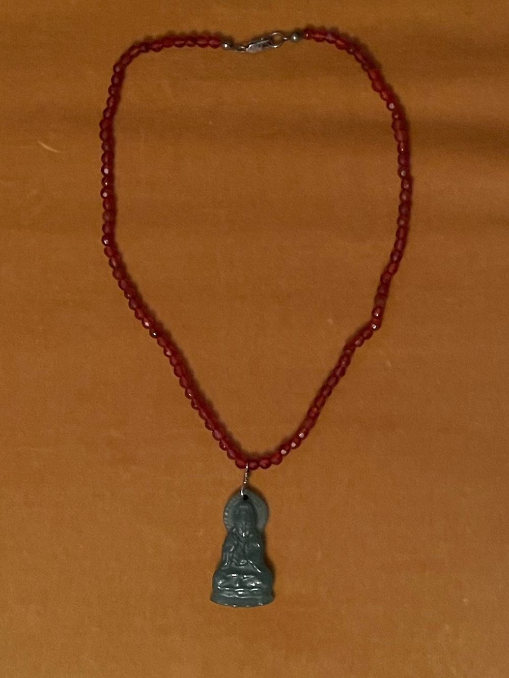 Green Jade Guanyin Pendant On A Faceted Carnelian Bead Necklace